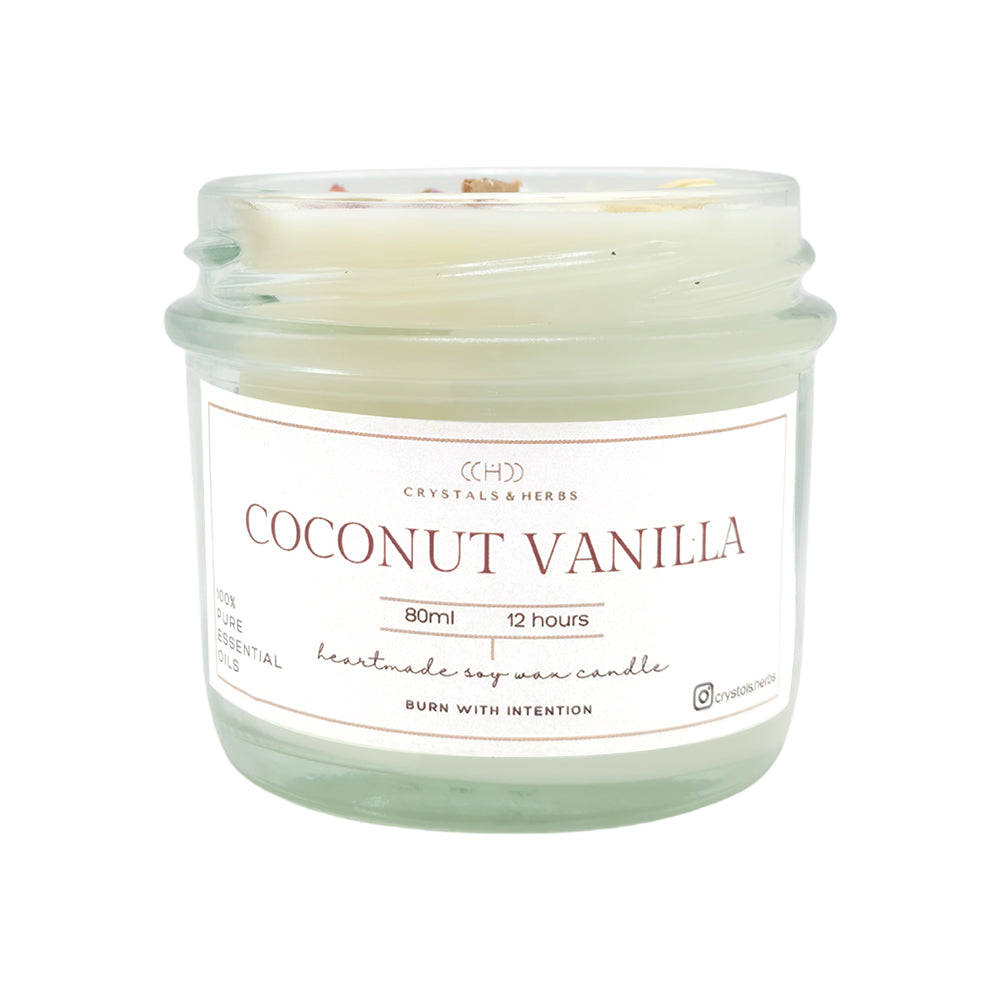 Coconut vanilla candle in a clear glass jar