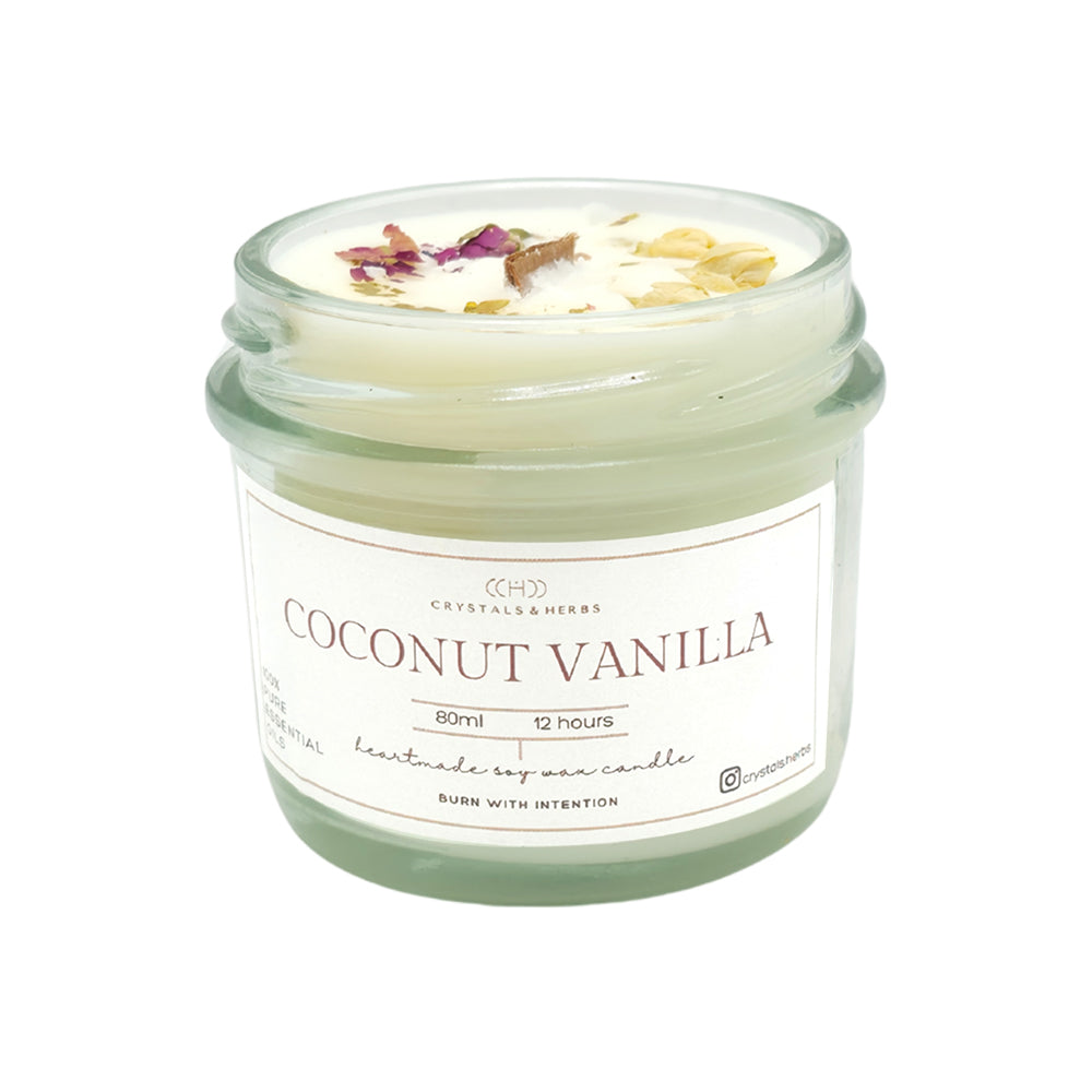 Coconut vanilla candle in a glass jar with a label on a white background